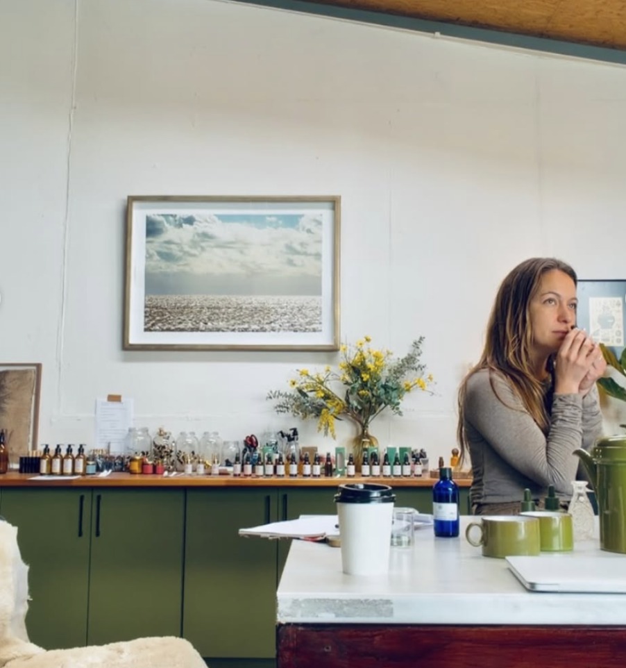 Inside the Petrichor Oils studio, a blend held to the nose among bottles and working materials